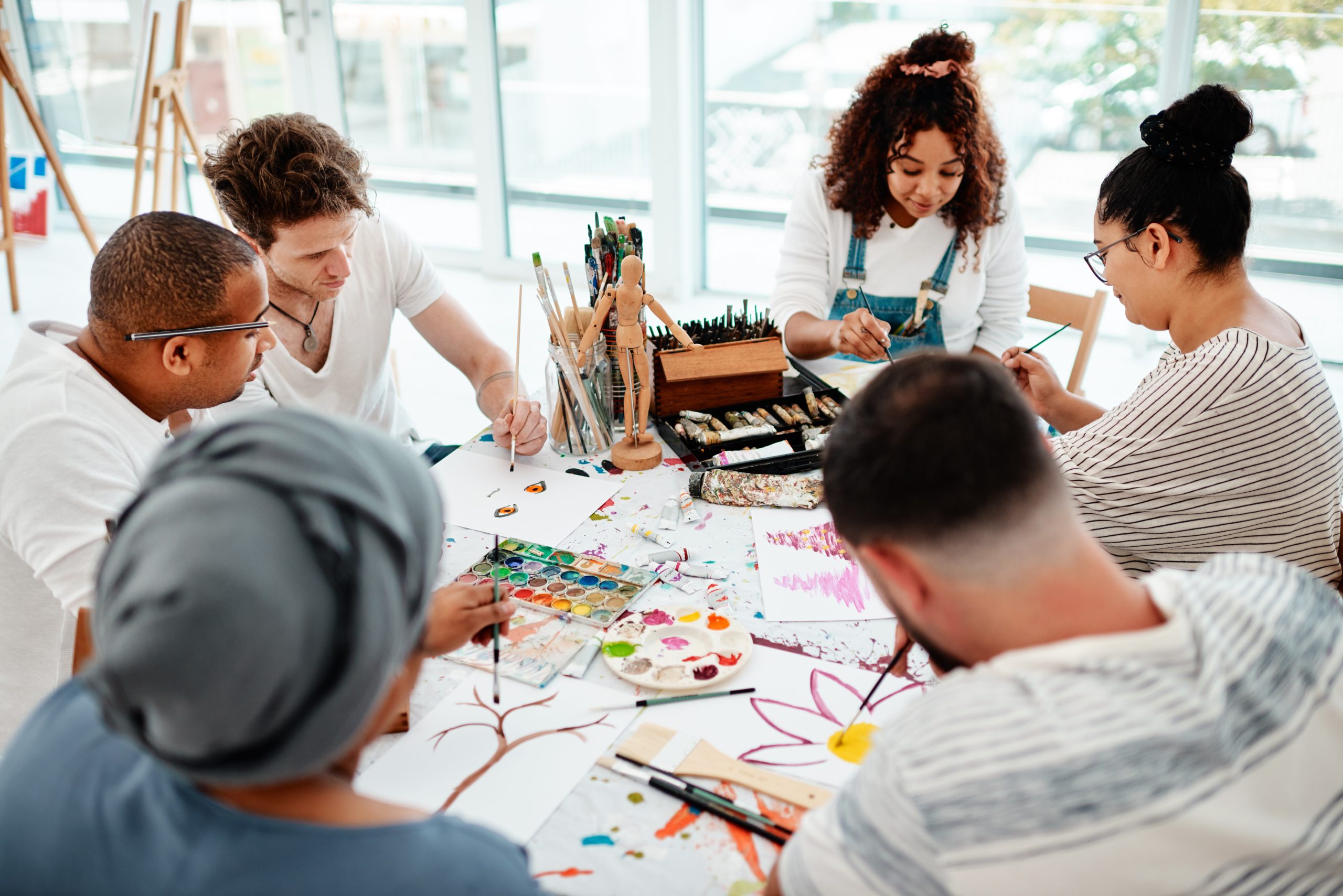 Art and Wine Workshop. Group of friends enjoy their art class.